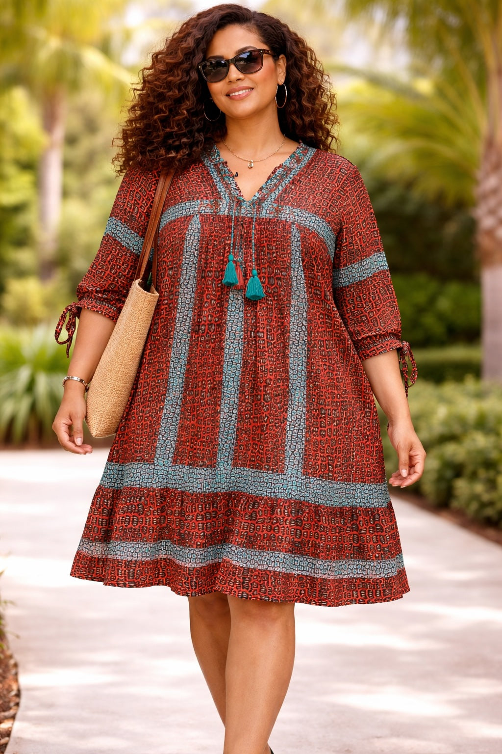 Women’s Rust African Print Dress with Blue Tassel Neck Detail