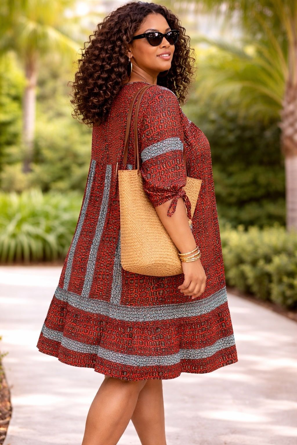 Women’s Rust African Print Dress with Blue Tassel Neck Detail