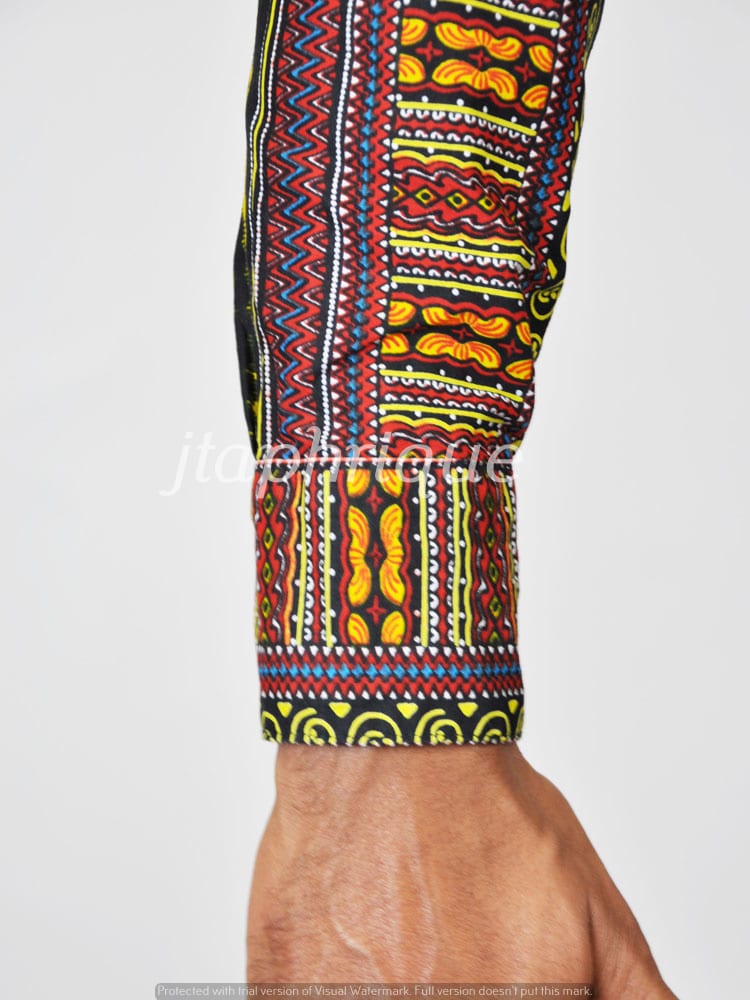 Close shot of multi-coloured African print pattern on the long sleeve of this dashiki shirt.