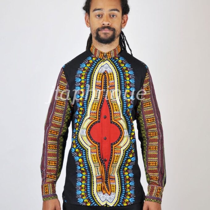 Frontal of model wearing a long sleeved dashiki shirt with multi-coloured traditional African print.