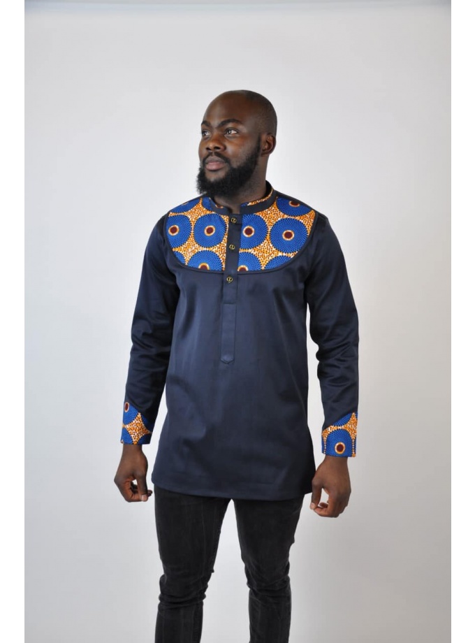 Full frontal of model wearing a men's dark blue / back shirt with stand collar and Subra African print detail on the chest, neckline and cuffs./