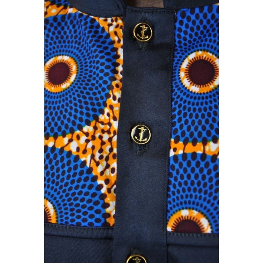 Close shot of Subra African print detail on upper chest for this men's dark blue-black shirt with stand collar.
