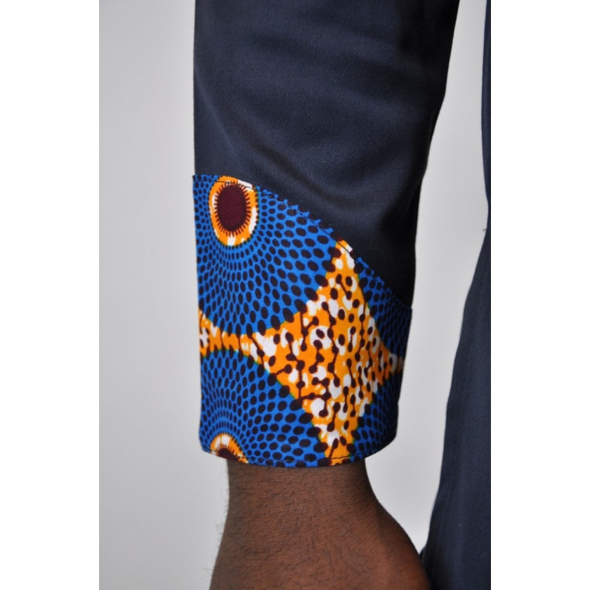 Close shot of Subra African print detail on the cuffs for this men's dark blue-black shirt with stand collar.
