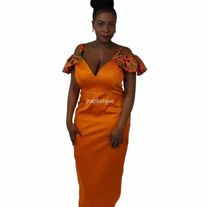 Frontal of model wearing a solid orange cold shoulder occasion dress with African Kente print ruffle detail on the sleeves.