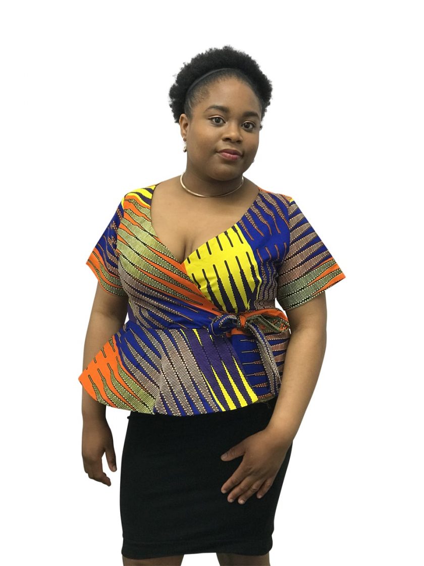 Frontal of model wearing a colourful Ankara v neck peplum top.