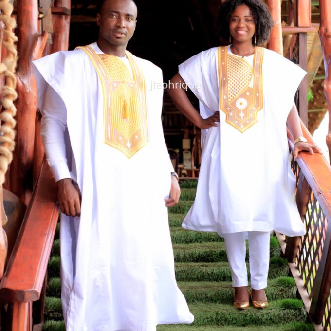 Frontal of male and female models wearing Mr & Mrs or his and hers matching traditional African embroidery suit outfits for couples. Perfect for a special occasion, wedding or Eid.