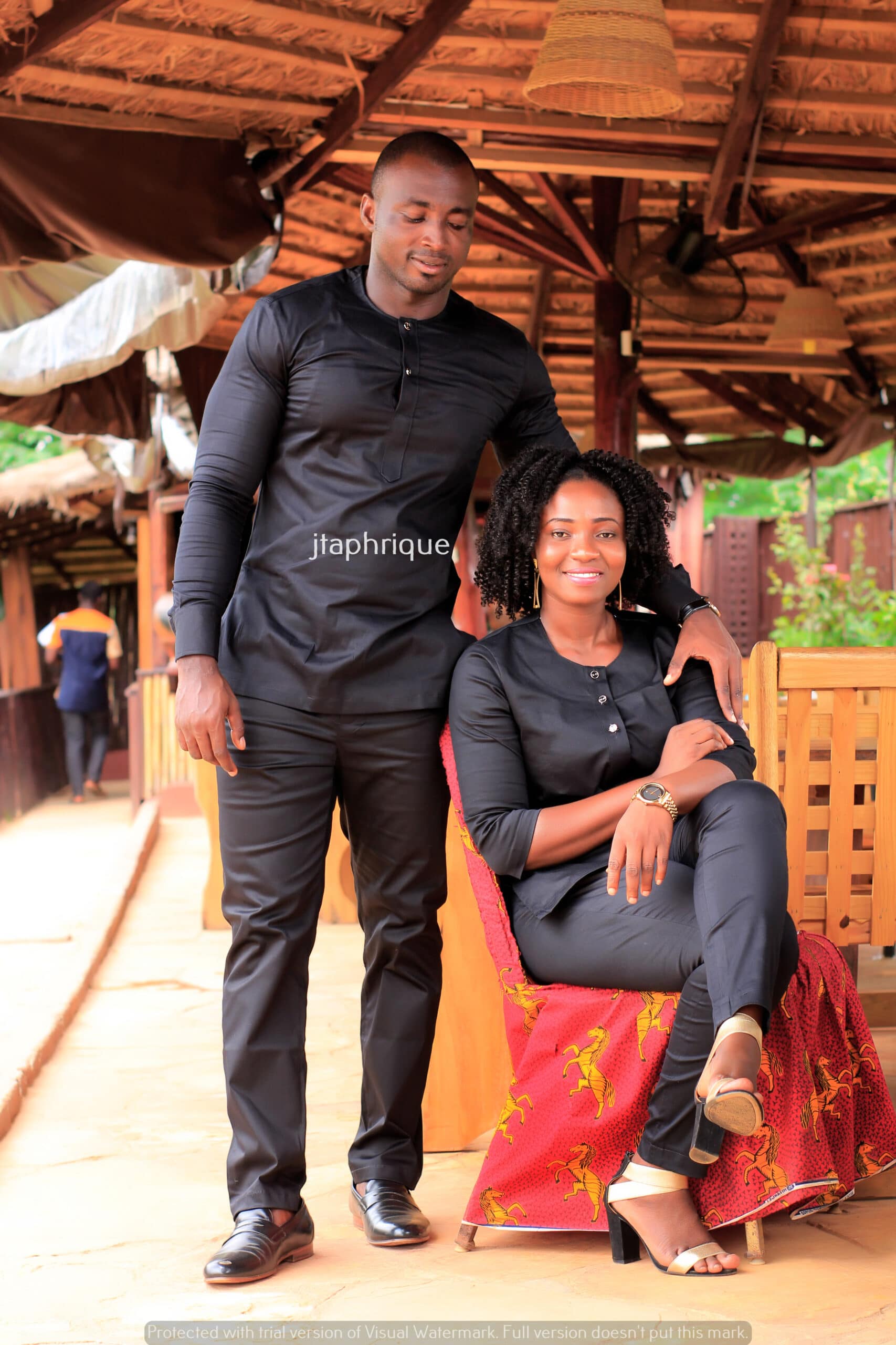 Frontal of models wearing his and hers matching African suits in black. Perfect for a special occasion, ceremony or Eid.