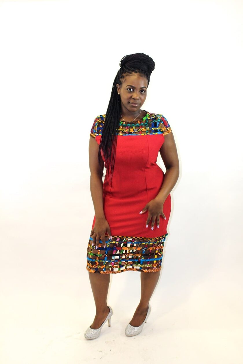 Full frontal of model wearing our solid red bodycon dress with mesh detail in African print.