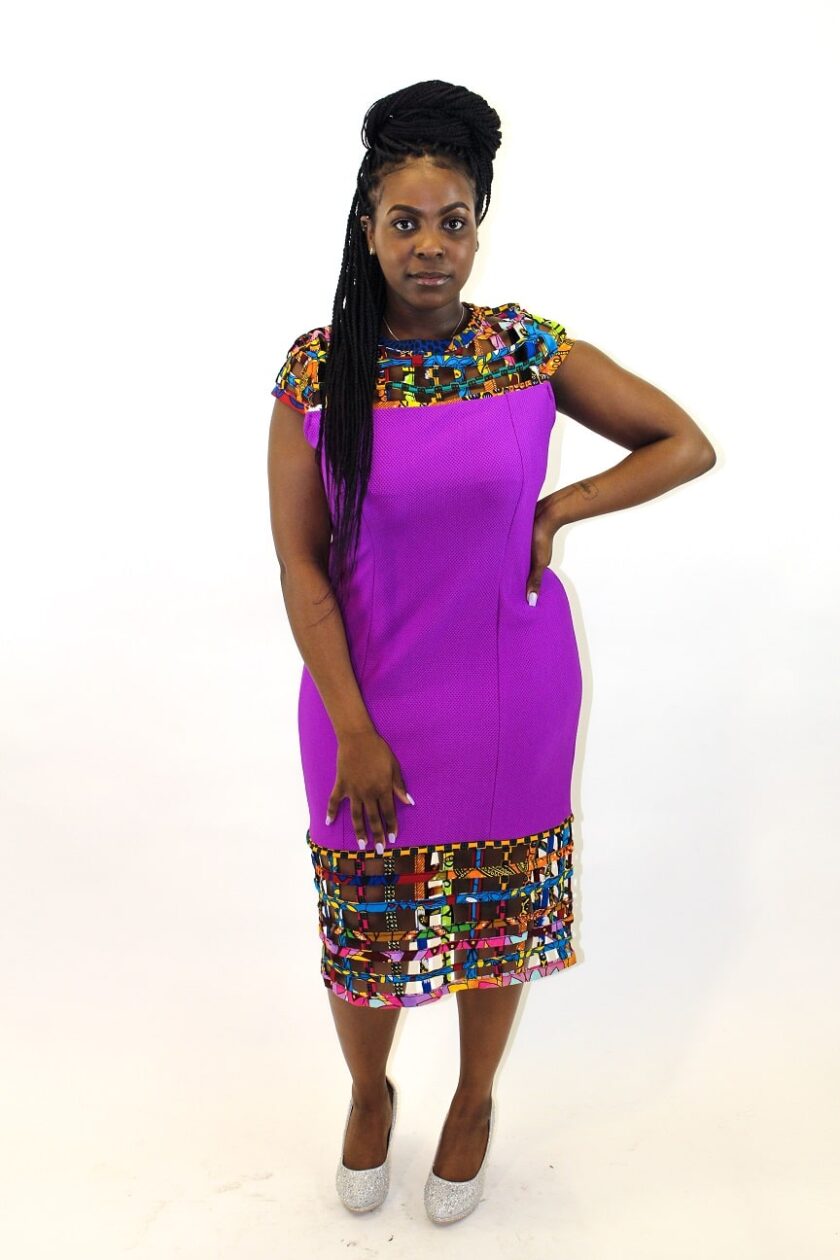 Full frontal of model wearing our solid purple bodycon dress with mesh detail in African print.
