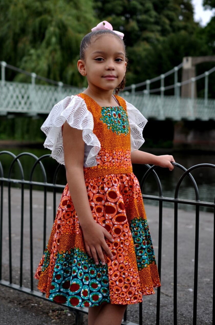 Kids size 5-7 year old occasion dress with lace around arm