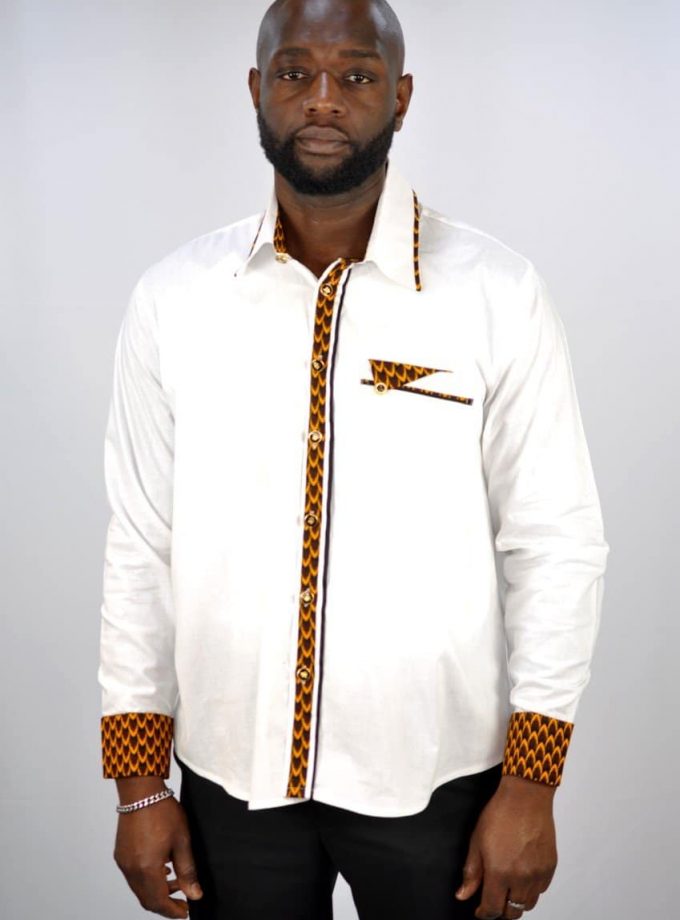 From our range of smart casual/business wear is this stylish mixed design black shirt made from polished cotton.  The front pocket, buttons and cuffs are embellished with a touch of Kente style print made from Ankara cloth.  For when you need something appropriate for work that has a touch of African print!
