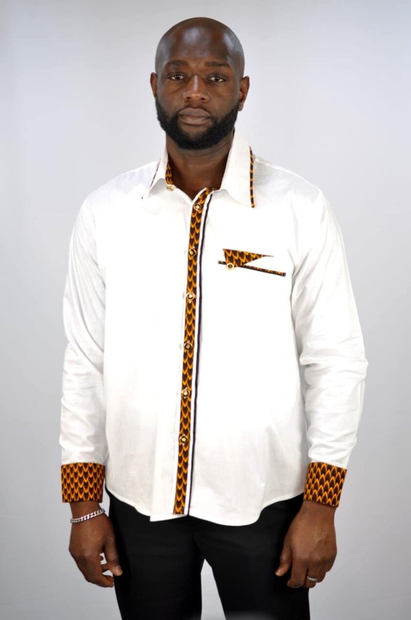 From our range of smart casual/business wear is this stylish mixed design black shirt made from polished cotton.  The front pocket, buttons and cuffs are embellished with a touch of Kente style print made from Ankara cloth.  For when you need something appropriate for work that has a touch of African print!