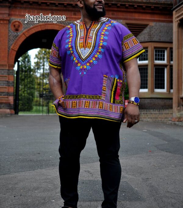 Full frontal of model wearing a men's purple traditional African shirt with Angelina dashiki pattern.