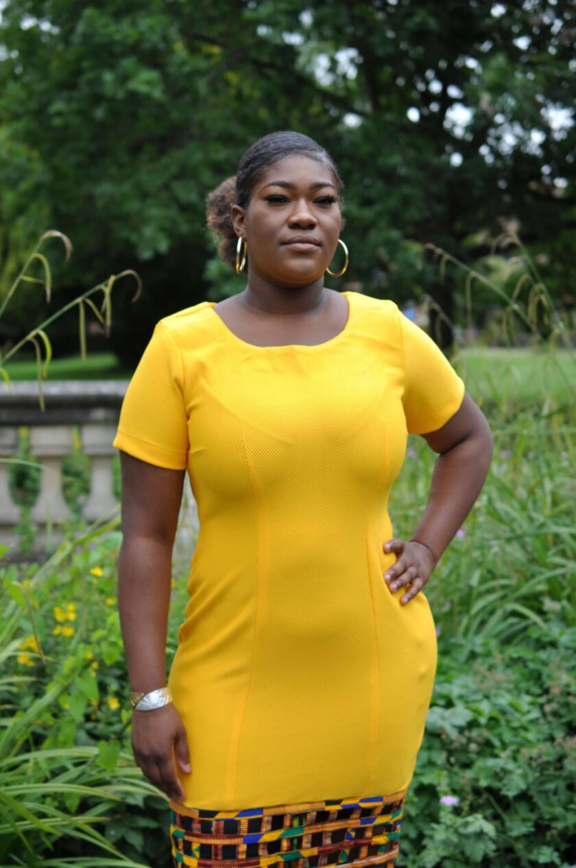Close shot of our yellow bodycon dress with Ankara mesh hem, custom made to your shape and measurements.