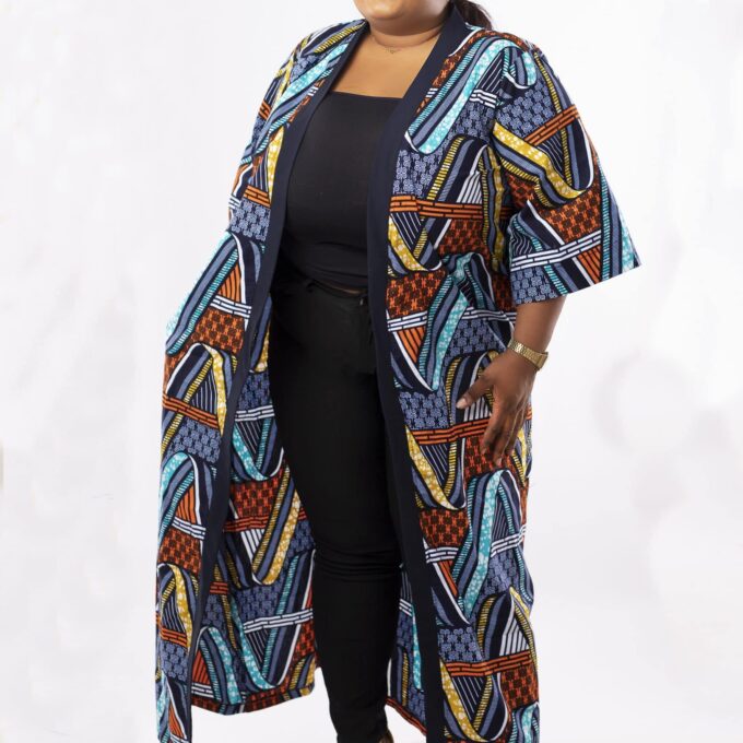 Frontal of model wearing a plus size kimono coat or jacket in all over African Ankara print.