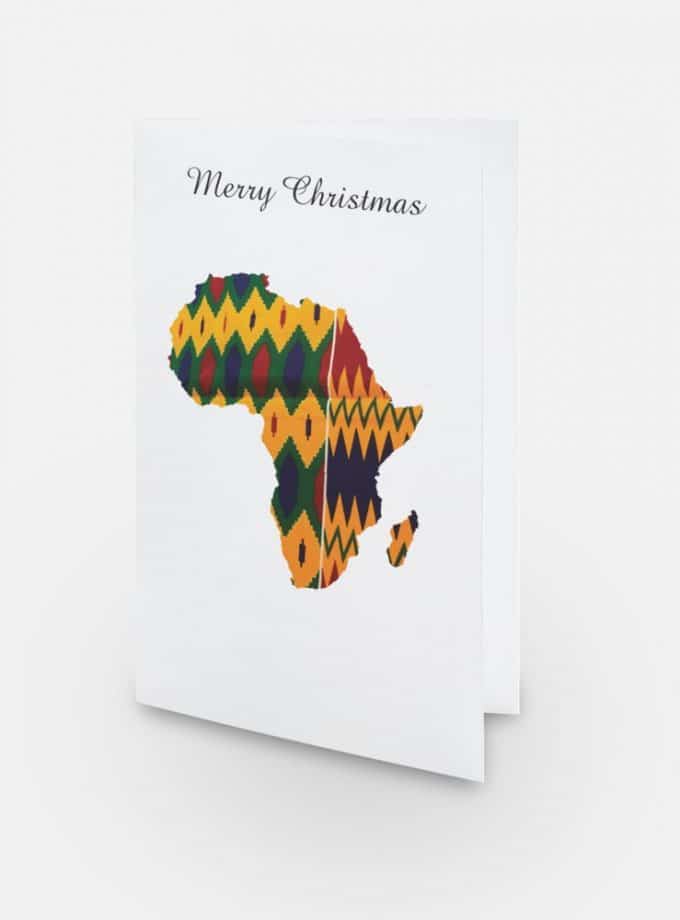Shot of a "Merry Christmas" greeting card with the shape of map of Africa decorated with multi-coloured African Kente print pattern. (Yellow, green, blue and red).