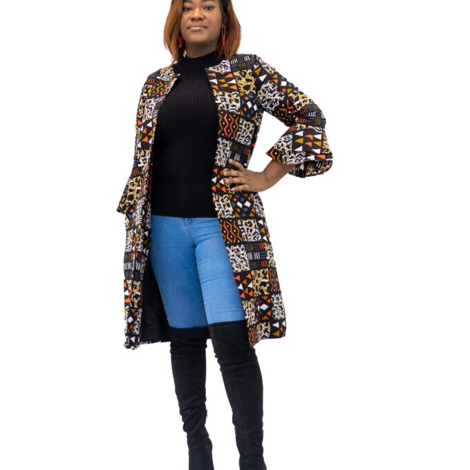 Frontal of model wearing a midi length ladies coat with round neck and all over African patchwork print in orange blue and multi-coloured.