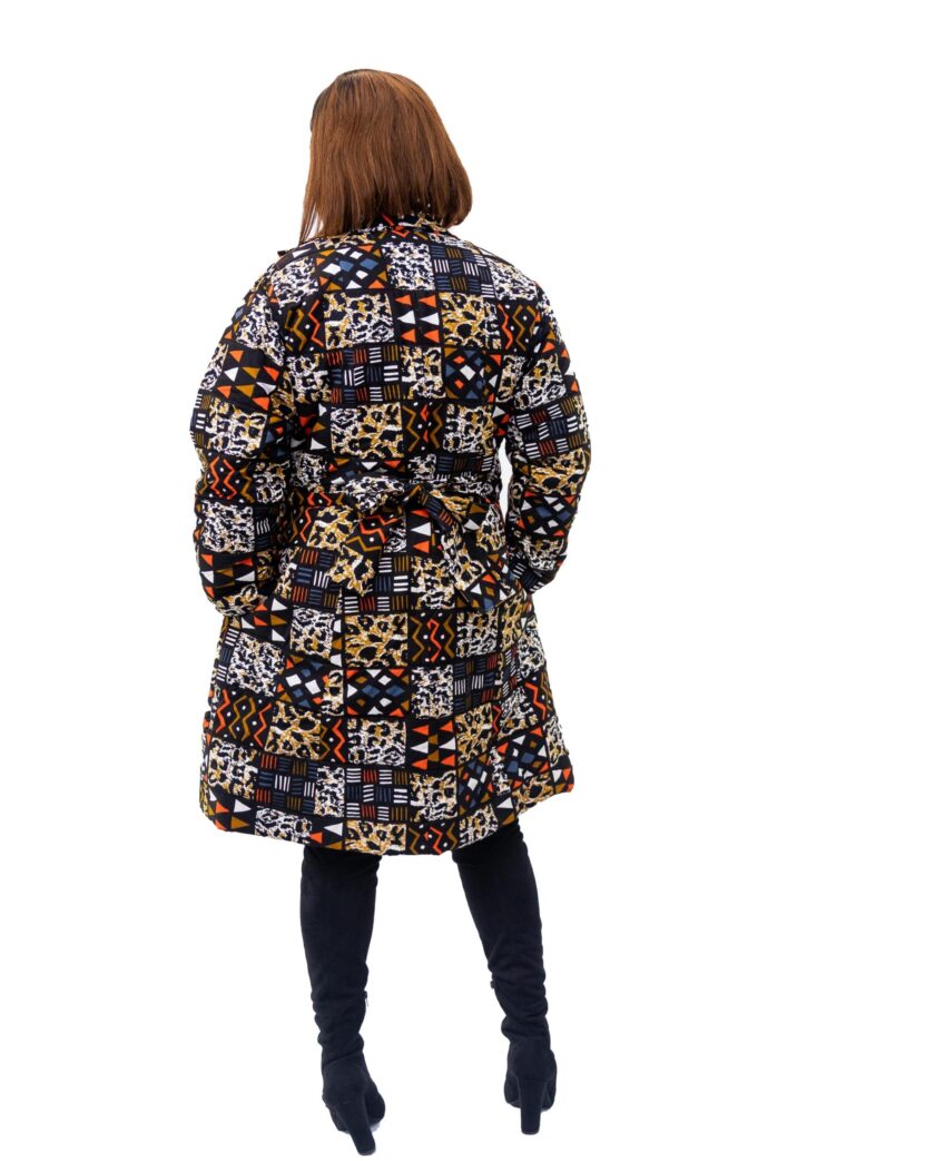 Back shot of model wearing a medium length blue and orange multi-coloured African patchwork print coat.