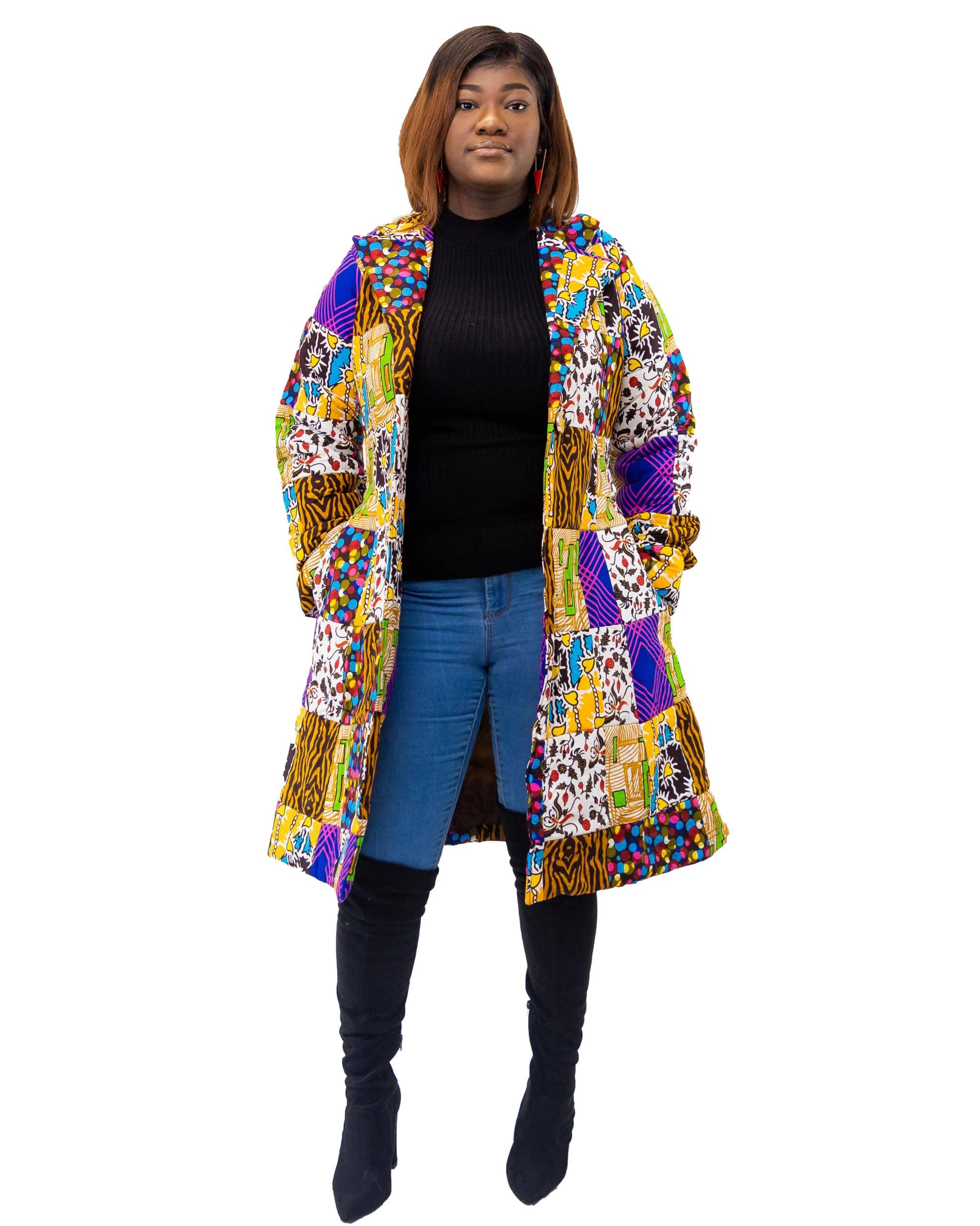 Full frontal of model wearing a medium length colourful African patchwork print coat.