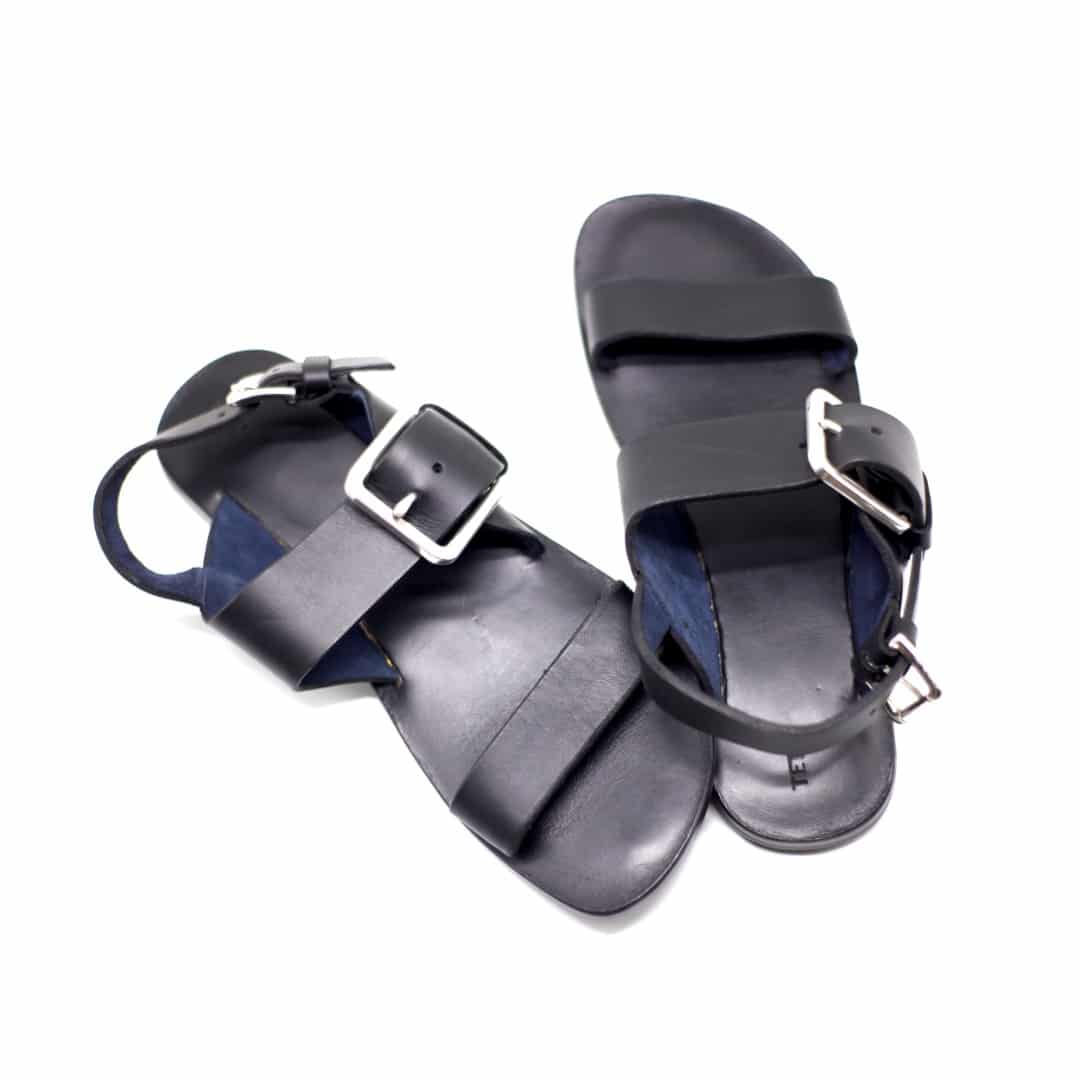 Shot of men's black leather sandals and slingback strap with a buckle.