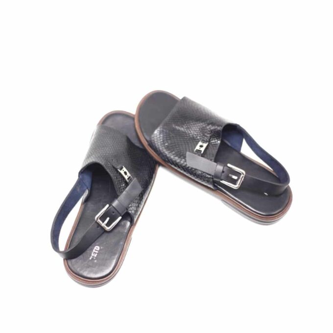 Shot of men's black leather slingback sandals with crocodile pattern, metal decor and buckle.