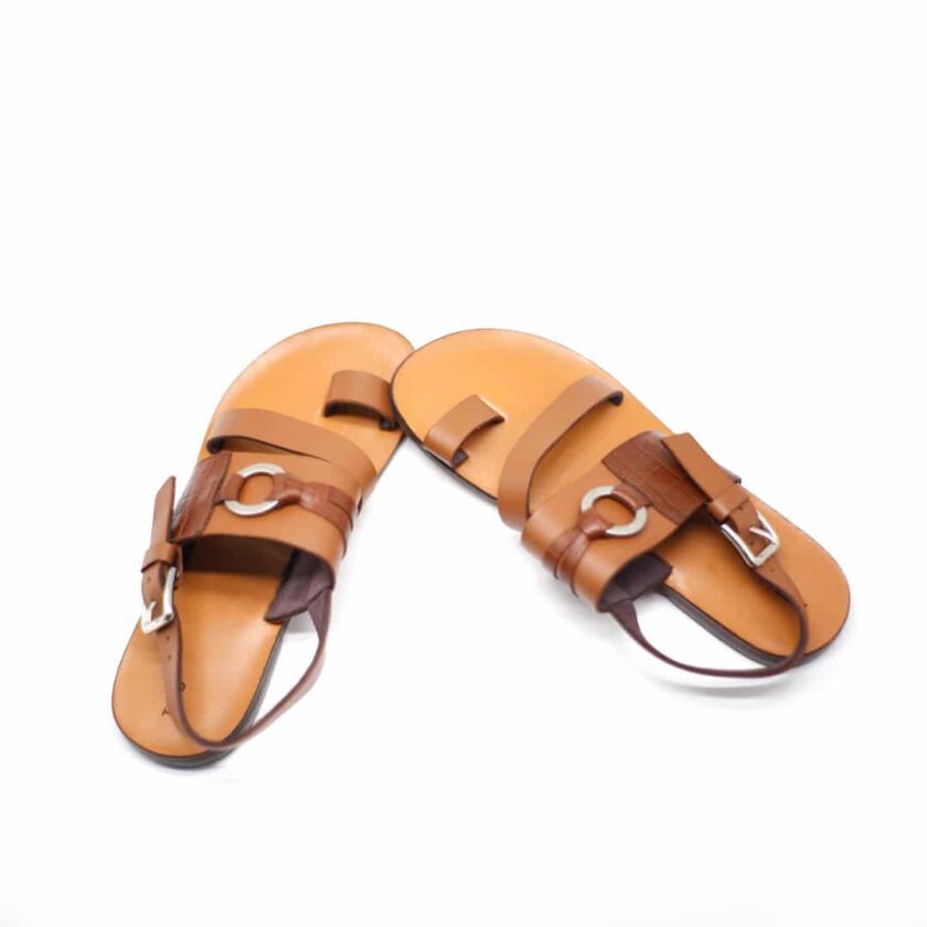 Shot of men's brown toe loop leather strap sandals.