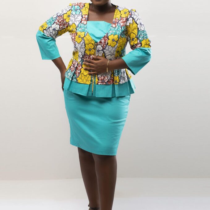 Frontal of model wearing our Angela two piece peplum top and skirt set in light blue and yellow African floral print. Features a contrasting solid light blue pencil skirt.