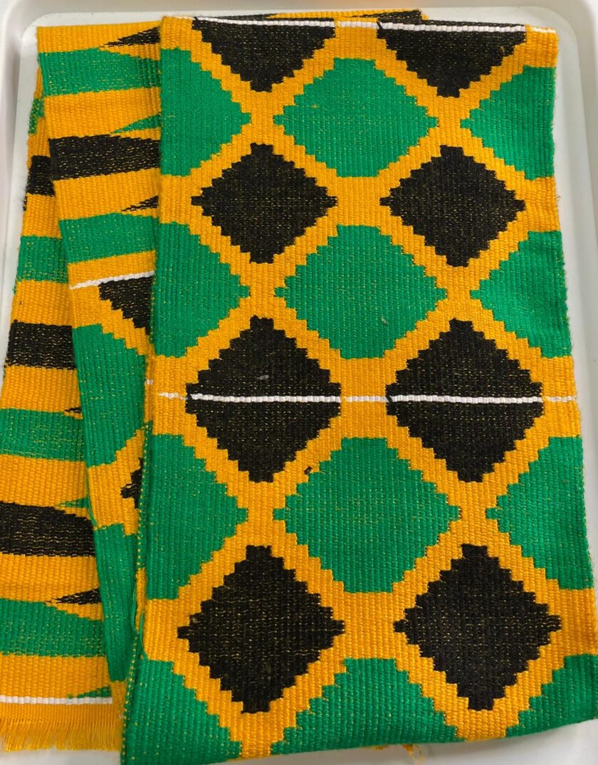 Our authentic hand woven African Kente Muffler or Stole in Jamaican flag colours and Afriican print pattern.